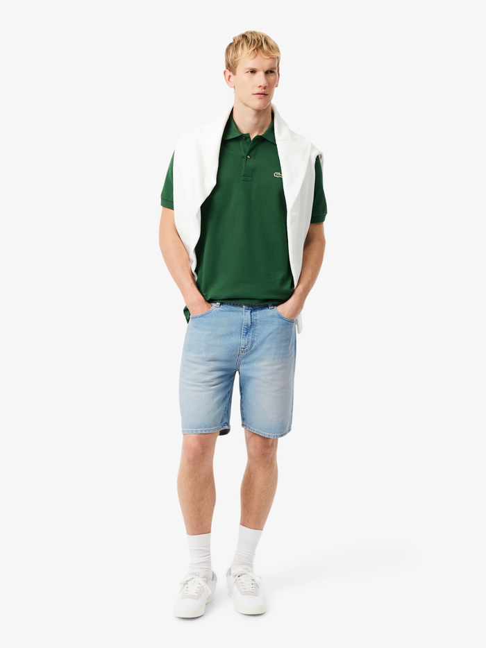 Side view of LACOSTE organic cotton denim Bermuda shorts with classic five-pocket design