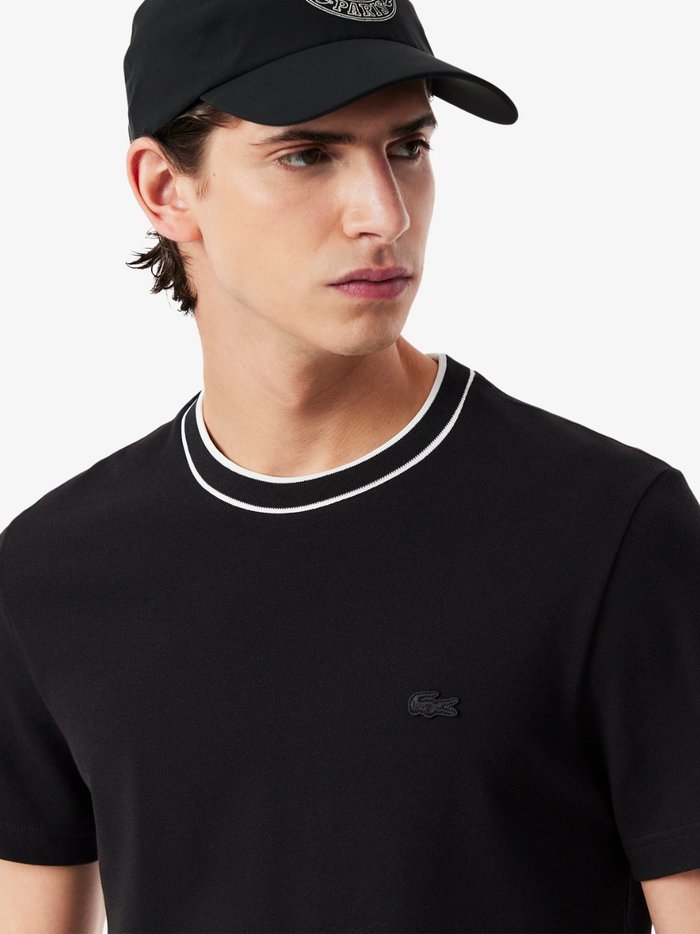 LACOSTE Stretch Piqué Stripe Collar T-shirt Black - close-up detail of striped collar and crocodile logo embroidery