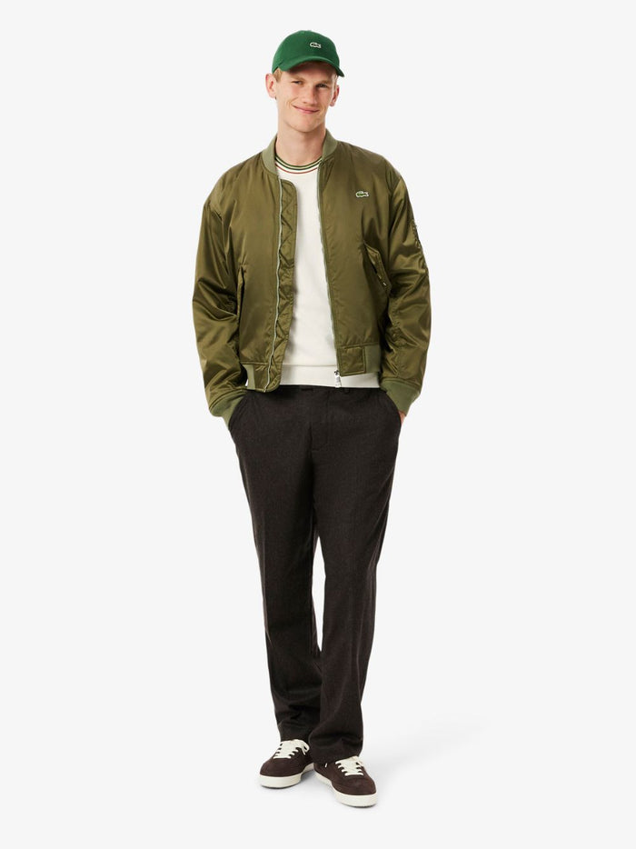 LACOSTE Striped Cotton Jersey Sweater - side profile view showcasing relaxed silhouette and sleeve detail in White
