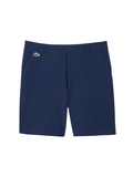 LACOSTE Ultra Dry Golf Shorts in midnight blue with silicone crocodile logo, front view