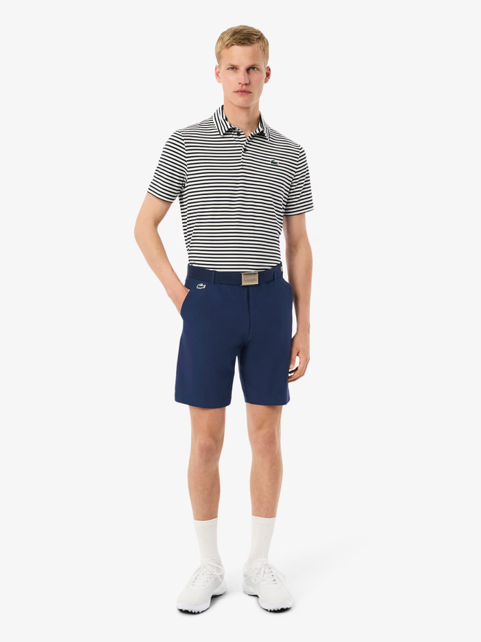 LACOSTE Ultra Dry Golf Shorts in midnight blue, side view showing regular fit and straight cut
