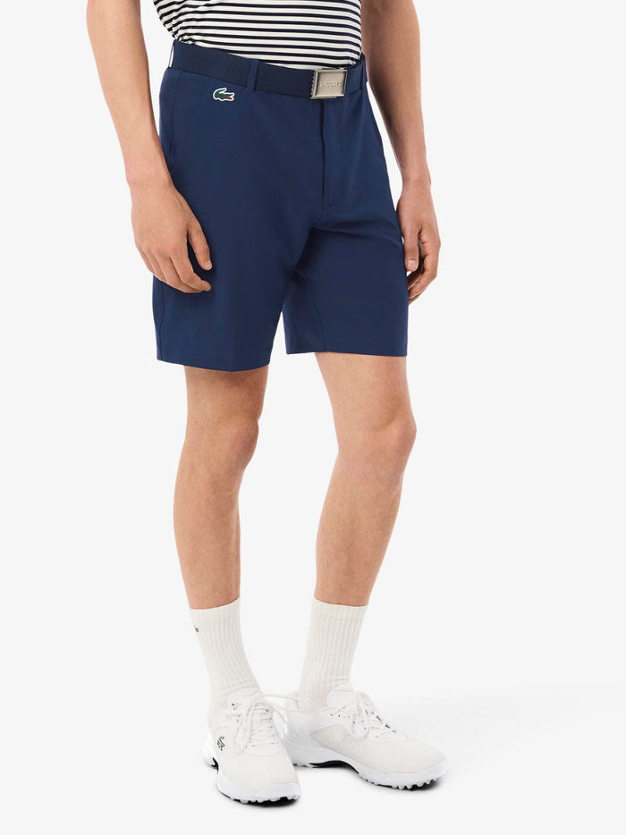 LACOSTE Ultra Dry Golf Shorts in midnight blue, back view with ball and notebook pockets