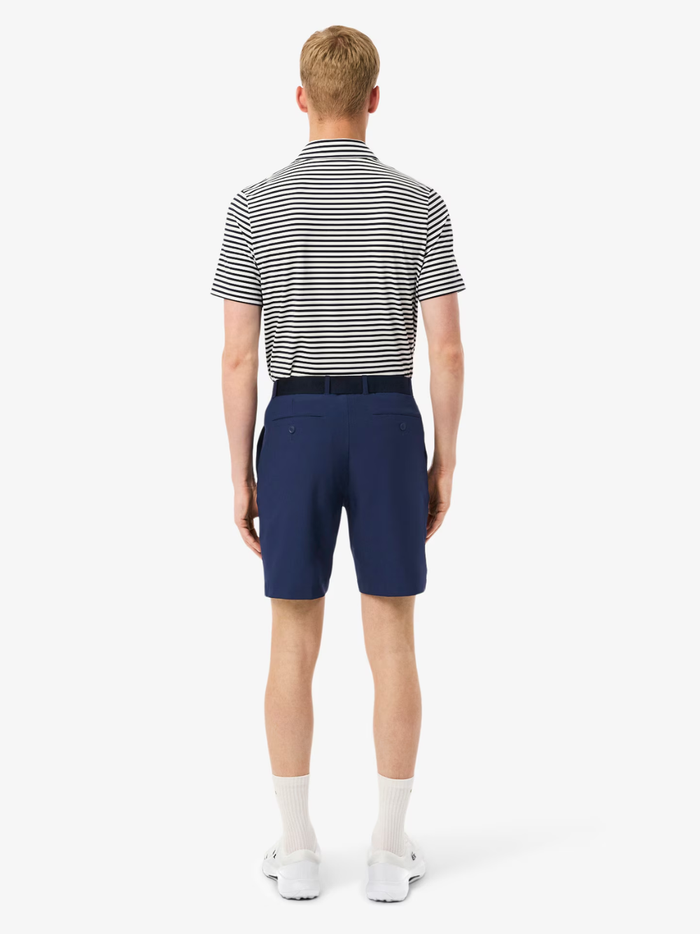 LACOSTE Ultra Dry Golf Shorts in midnight blue, detail view of moisture-wicking fabric and construction