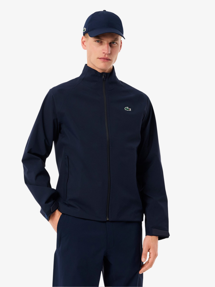 LACOSTE Water-Repellent Golf Stretch Windbreaker in navy - back view displaying the jacket's stretch fabric construction and golf-specific tailoring