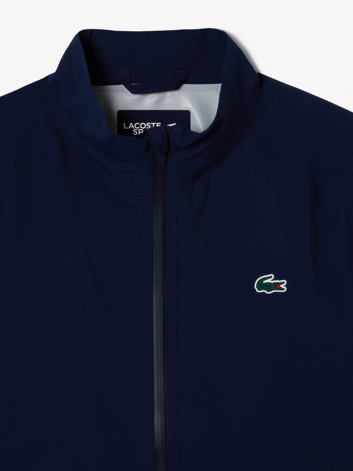 LACOSTE Water-Repellent Golf Stretch Windbreaker in navy - styled view showcasing the versatile navy colour perfect for golf and active wear