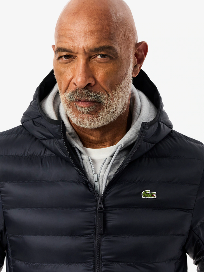 LACOSTE Water-Repellent Quilted Puffed Jacket in navy - side view highlighting the puffed silhouette and functional design