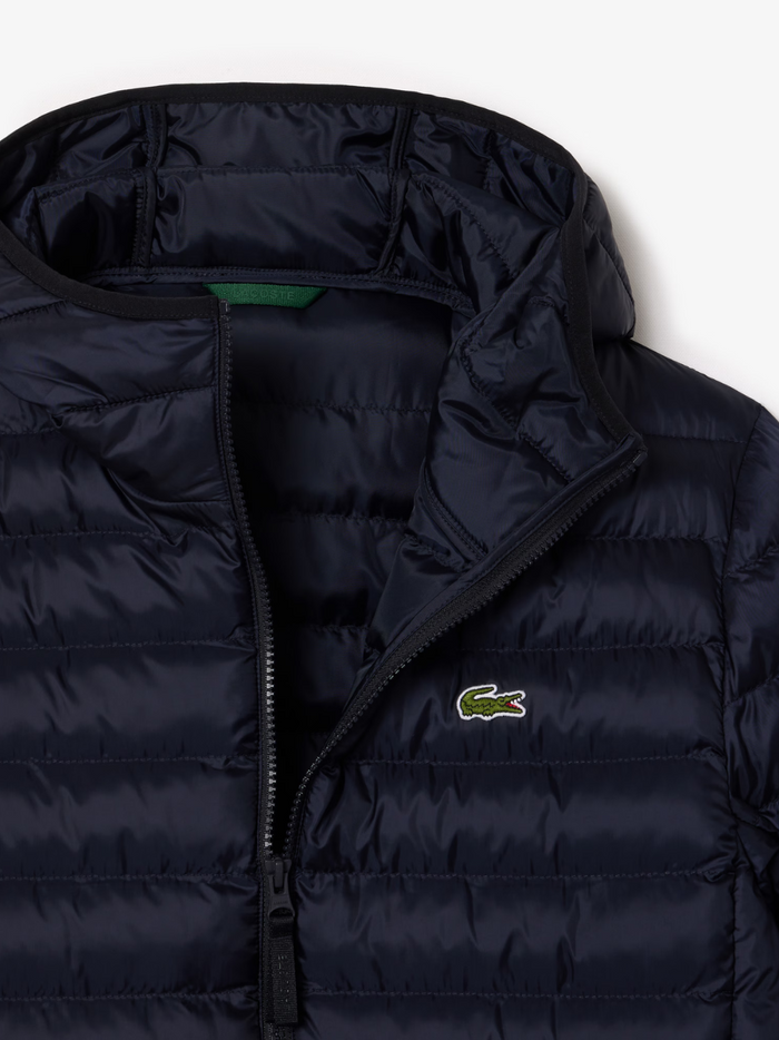 LACOSTE Water-Repellent Quilted Puffed Jacket in navy - styled view showcasing the versatile navy colour and premium quilted construction