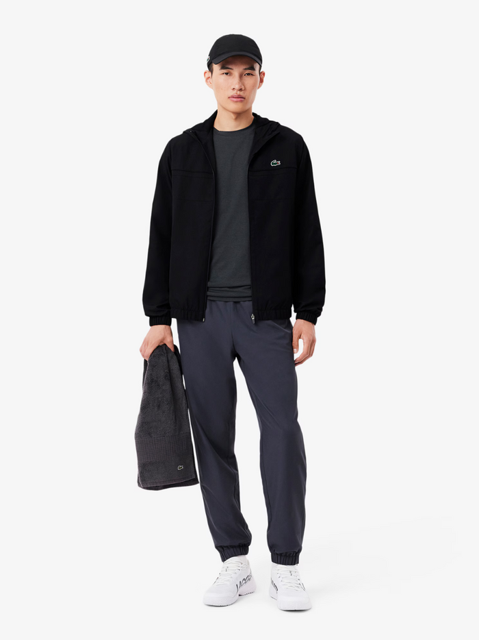 LACOSTE Water-Repellent Track Jacket Black - Side profile showing sporty silhouette and functional design details