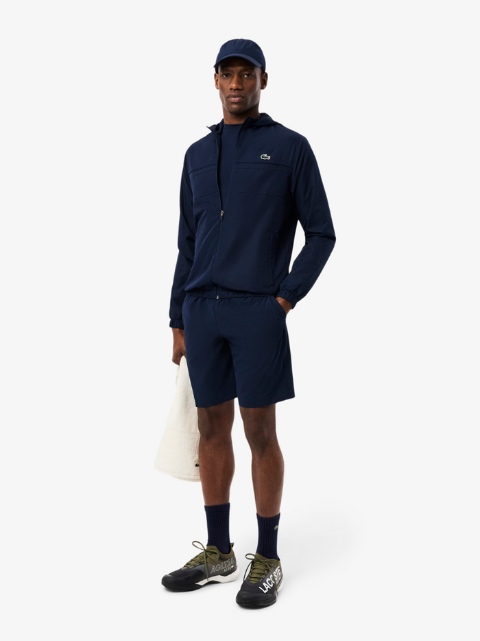 LACOSTE Water-Repellent Track Jacket Navy - Side profile showing sporty silhouette and functional design details