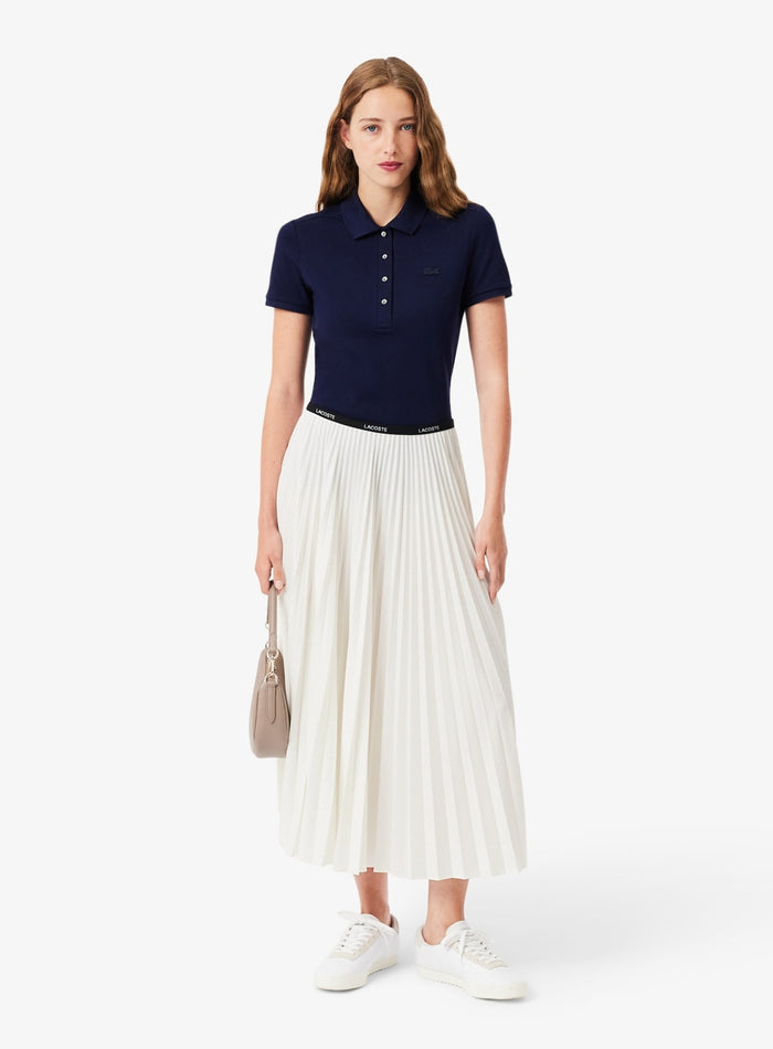 Back view of Lacoste white pleated skirt with signature branded elastic waistband