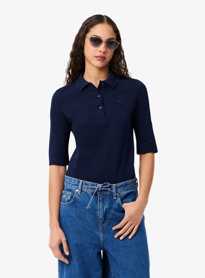 Lacoste Women Slim Fit polo shirt in midnight blue - side view showing three quarter sleeve length