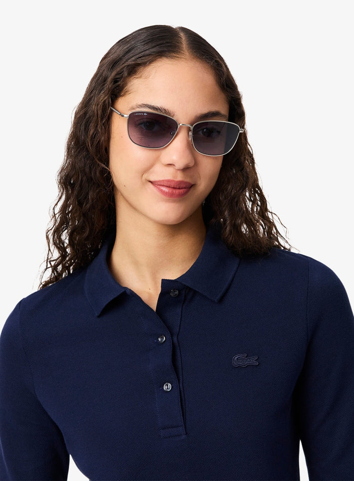 Lacoste Women L.12.D polo shirt detail - close-up of iconic crocodile logo on midnight blue