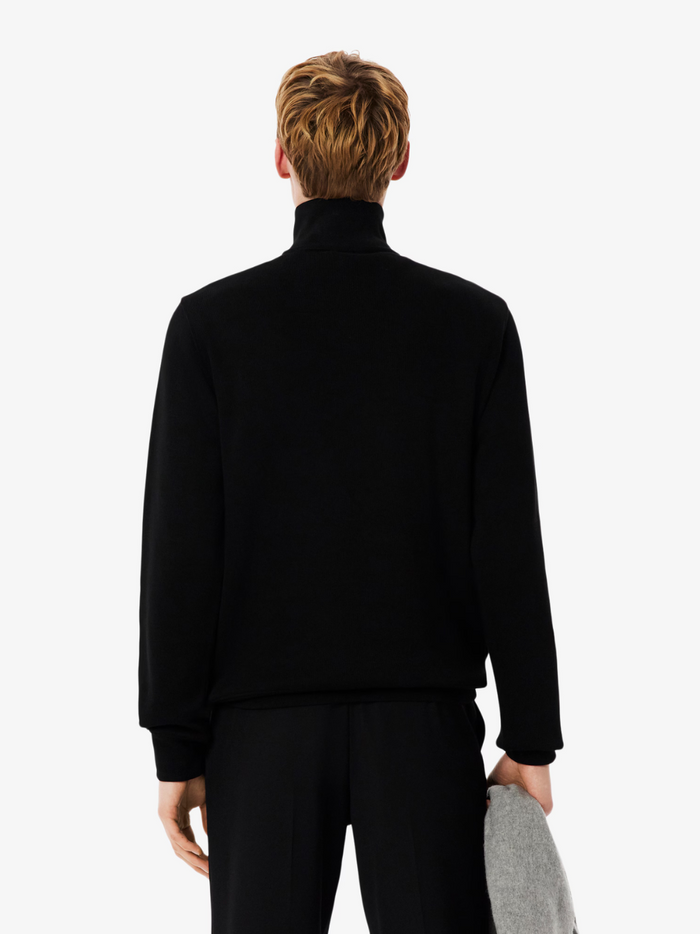 LACOSTE black high neck zip-up sweatshirt lifestyle shot demonstrating sporty styling and comfortable fit