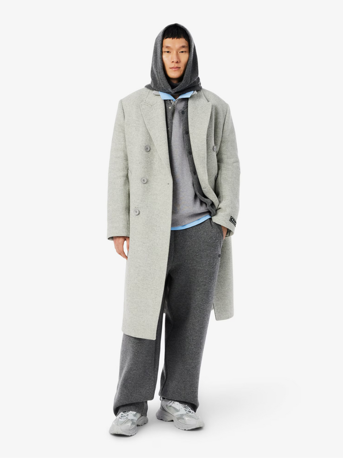 LACOSTE grey zip-up sweatshirt side profile highlighting high neck collar and athletic fit silhouette