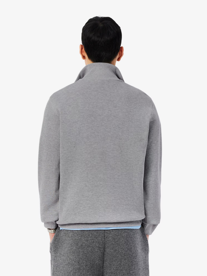 LACOSTE grey high neck zip-up sweatshirt lifestyle shot demonstrating sporty styling and comfortable fit