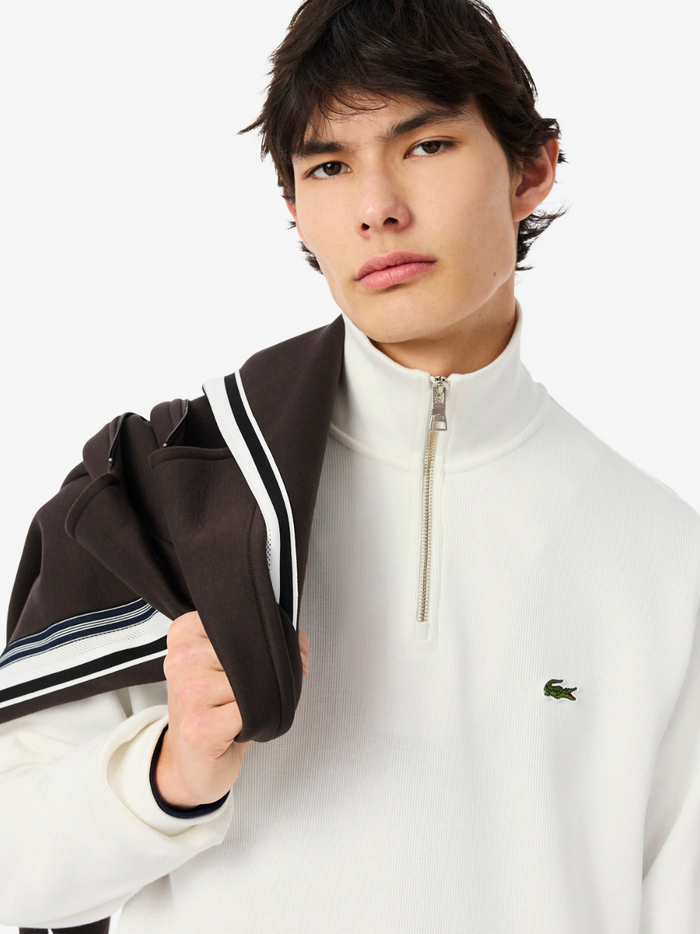 LACOSTE White Zip-Up Sweatshirt - Close-up detail of the embroidered crocodile logo and high neck collar construction