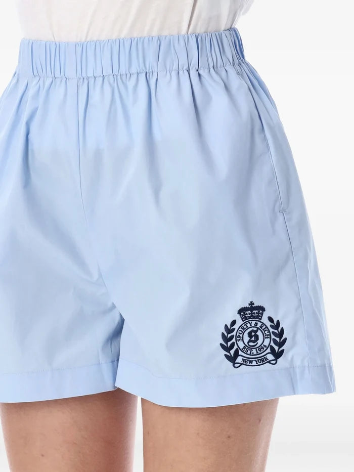 SPORTY & RICH WOMEN H&W Crest Poplin Shorts Washed Hydrangea - MAISONDEFASHION.COM