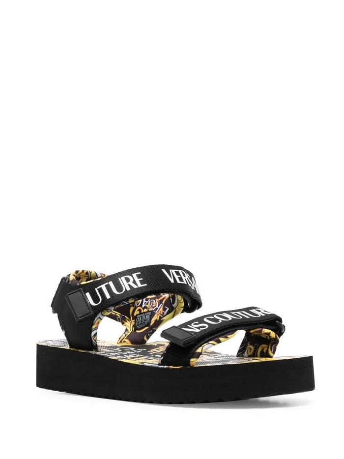 VERSACE WOMEN Baroque Logo Print Sandals Black/Gold - MAISONDEFASHION.COM