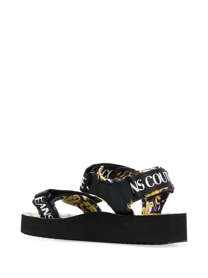 VERSACE WOMEN Baroque Logo Print Sandals Black/Gold - MAISONDEFASHION.COM